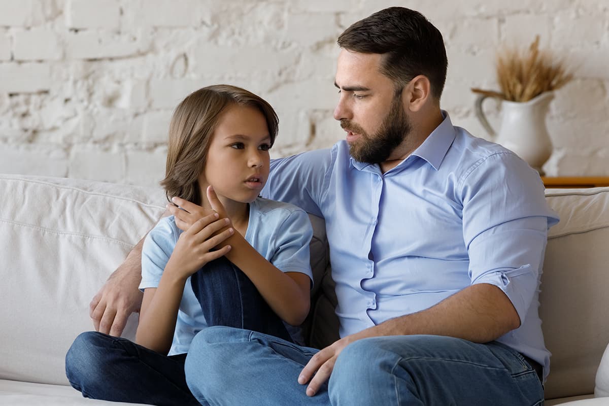 father and son talking about the child's school anxiety